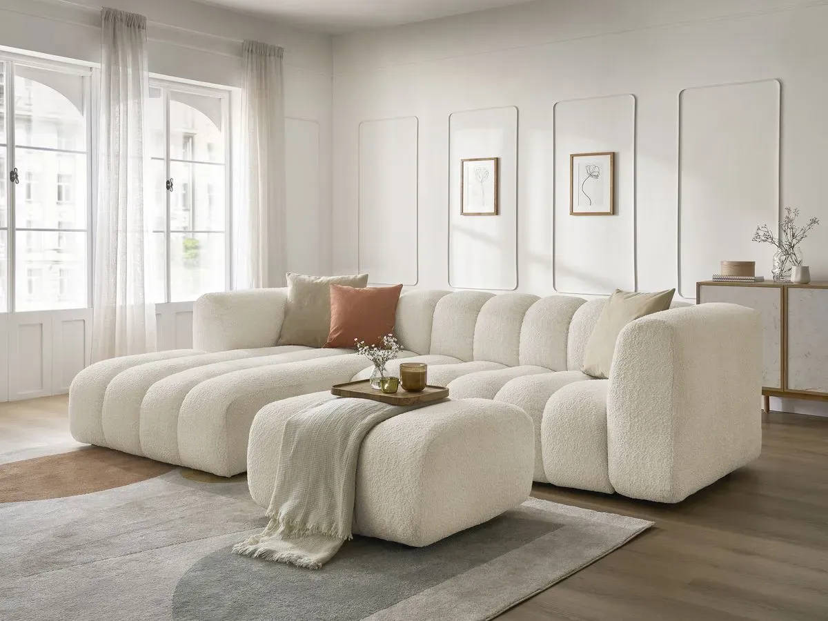 Canapé d'angle fixe TALIA tissu bouclette avec pouf beige  angle gauche BOBOCHIC 4 places