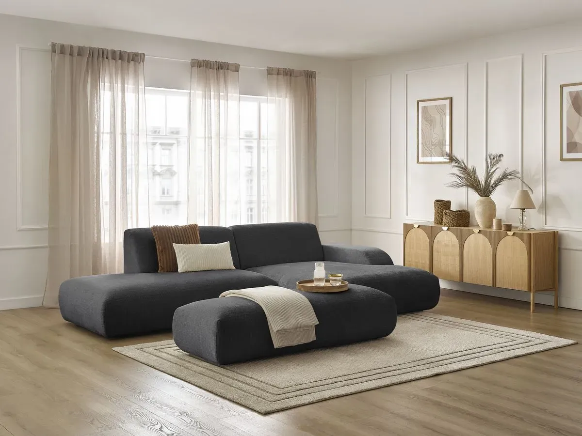 Canapé d'angle fixe SIRIUS tissu texturé avec grand pouf noir  angle droit BOBOCHIC 4 places