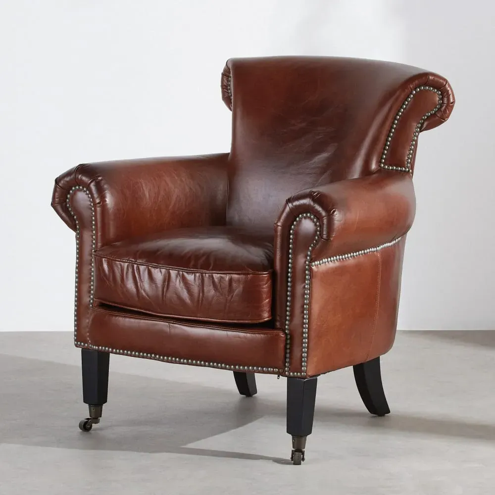 Fauteuil en cuir marron effet vieilli