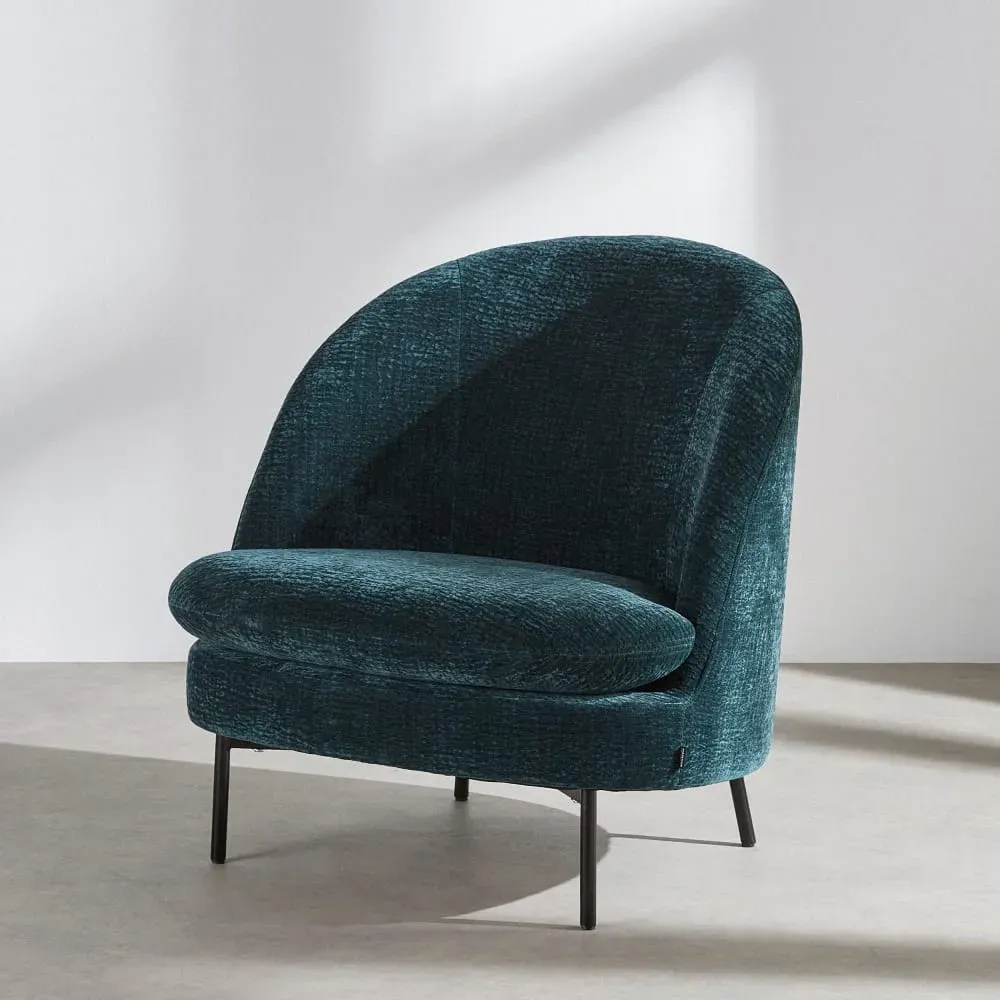 Fauteuil en tissu texturé bleu pétrole
