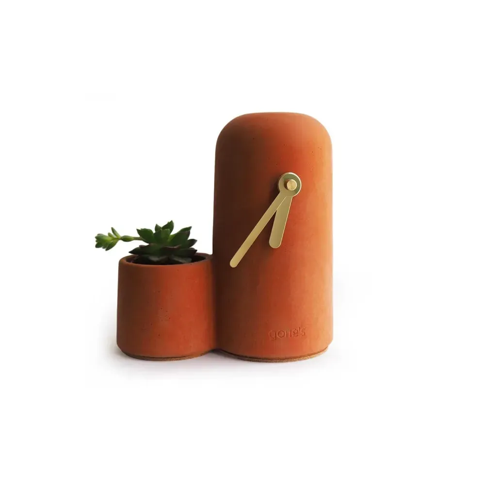 Horloge en béton terracotta aiguilles dorées