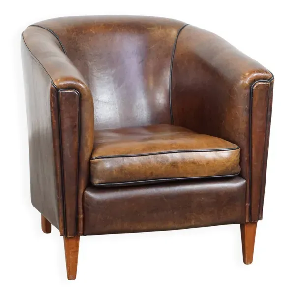 Fauteuil club en cuir de mouton avec passepoil noir