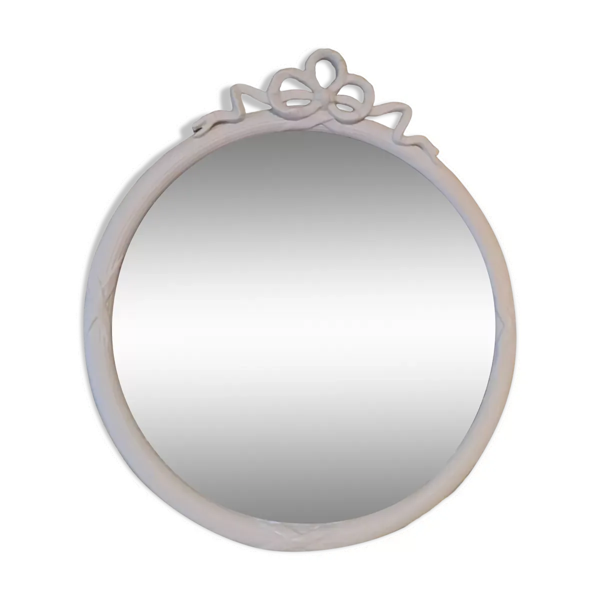Miroir rond en bois sculpté avec en haut un ruban formant un noeud coloris crème