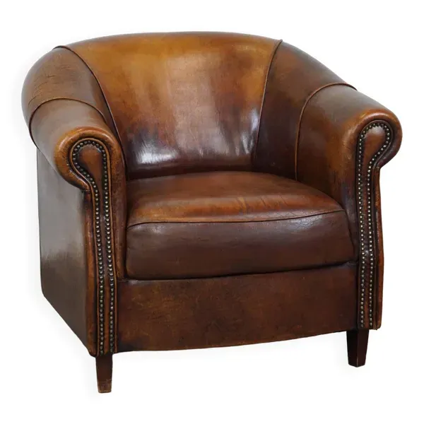Fauteuil club en cuir de mouton avec de belles couleurs et une assise confortable