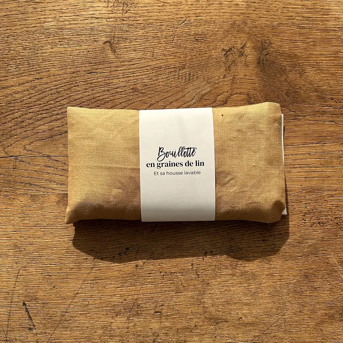 Illustration numéro 2 du produit Bouillotte en graines de lin doré 10x20