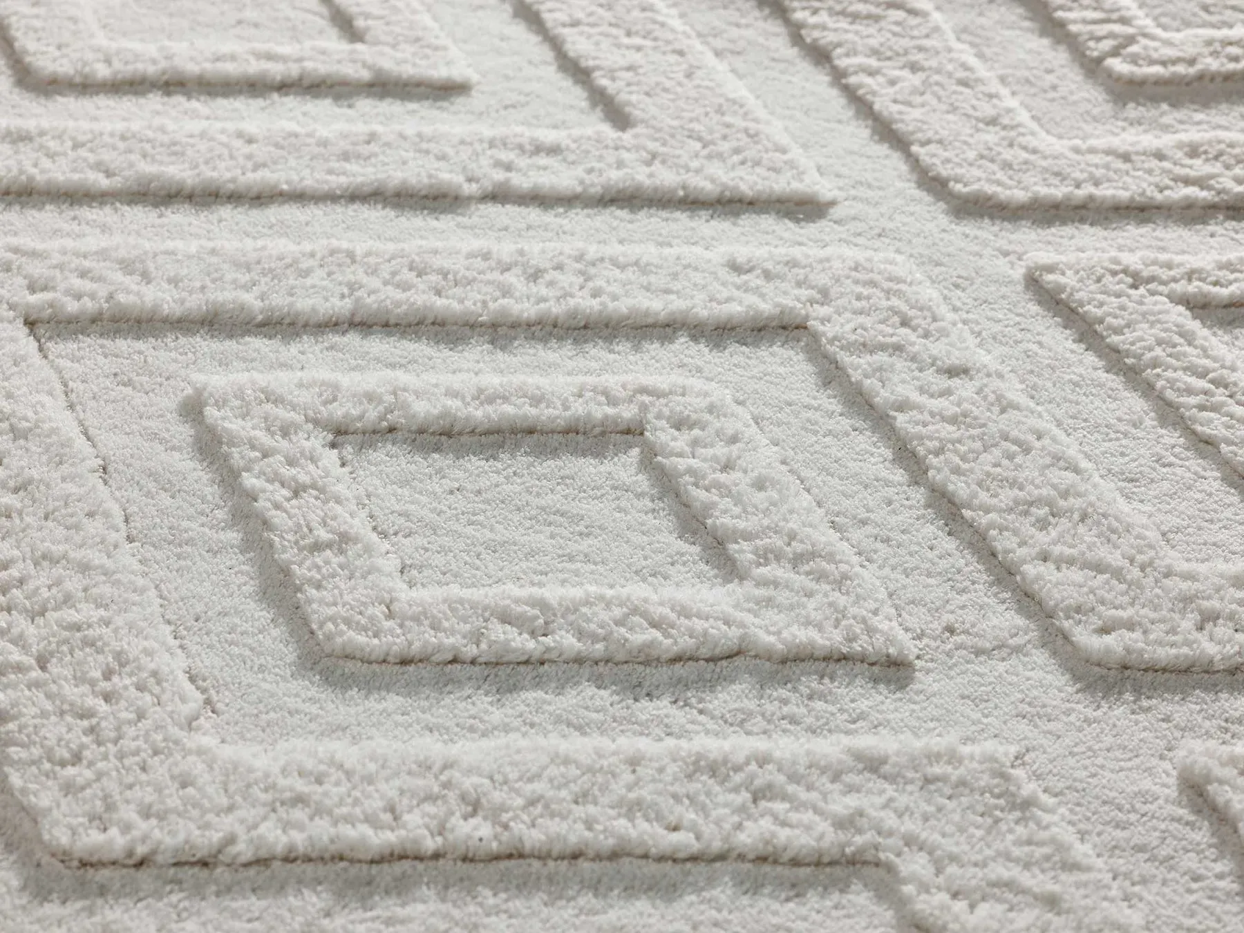 Illustration numéro 2 du produit Tapis lavable à relief blanc 120x170 cm