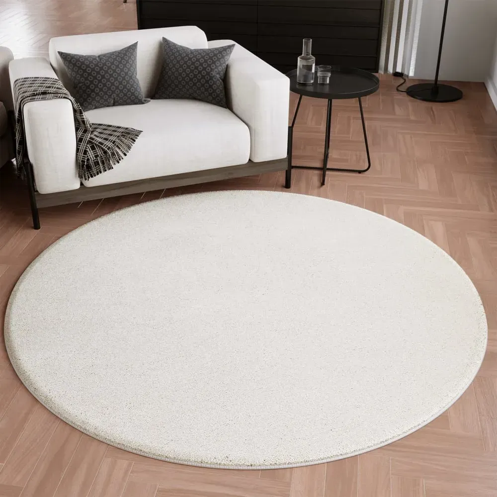 Illustration numéro 2 du produit Tapis rond uni poils ras beige ivoire belle densité Ø 120