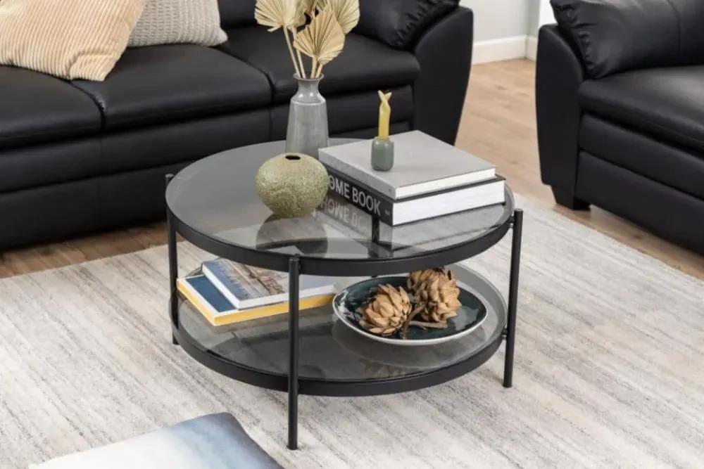 Illustration numéro 2 du produit Table basse ronde en verre et métal noir