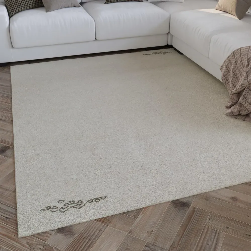 Illustration numéro 2 du produit Tapis pure laine écru  tufté main motif discret 110x170