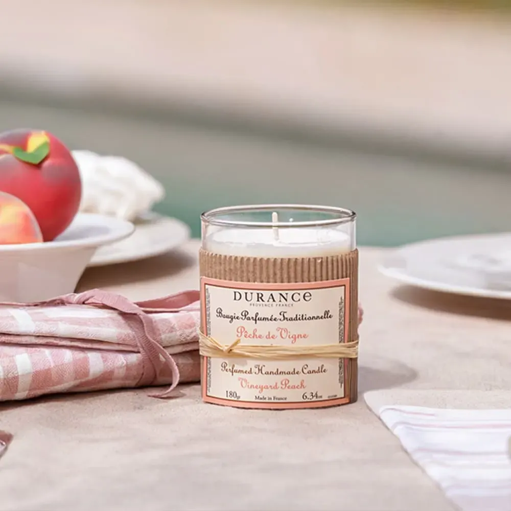 Illustration numéro 2 du produit Bougie parfumée pêche de vigne