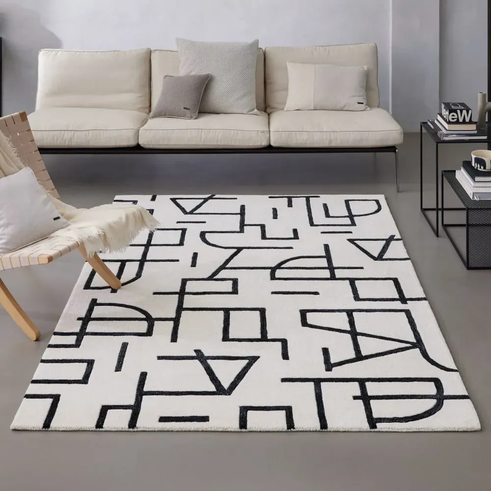 Illustration numéro 2 du produit Tapis design graphique tufté pure laine ivoire et noir  110x170