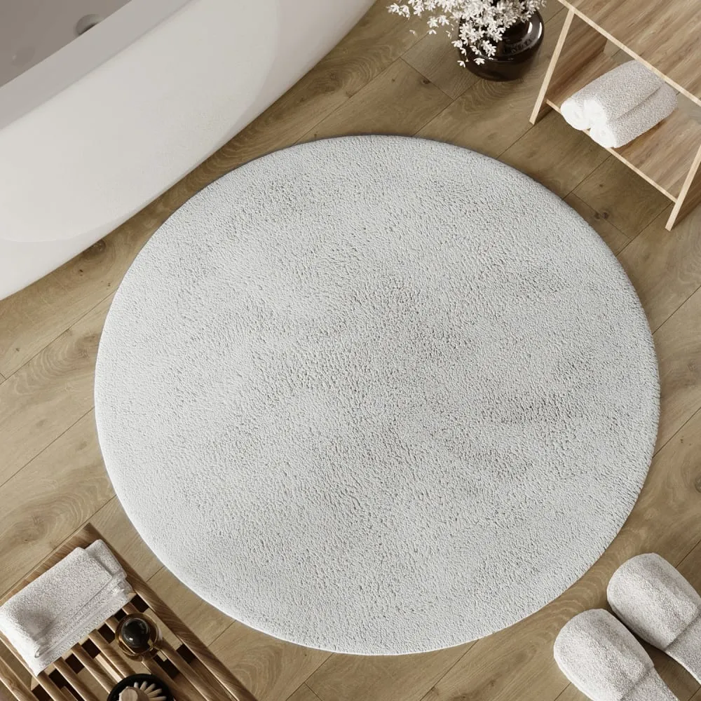 Illustration numéro 2 du produit Tapis de bain blanc rond en coton 80 rd.