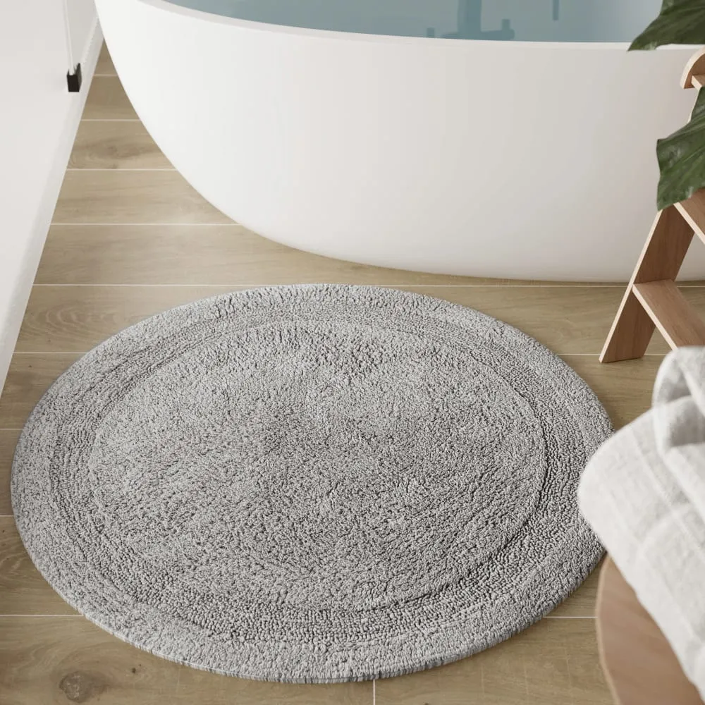 Illustration numéro 2 du produit Tapis de bain gris clair rond en coton 80 rd.