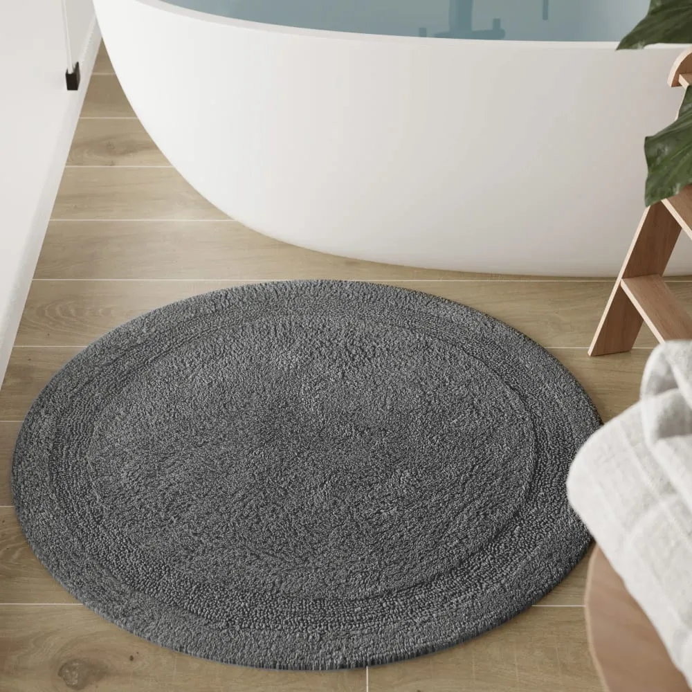 Illustration numéro 2 du produit Tapis de bain gris granit rond en coton 80 rd.
