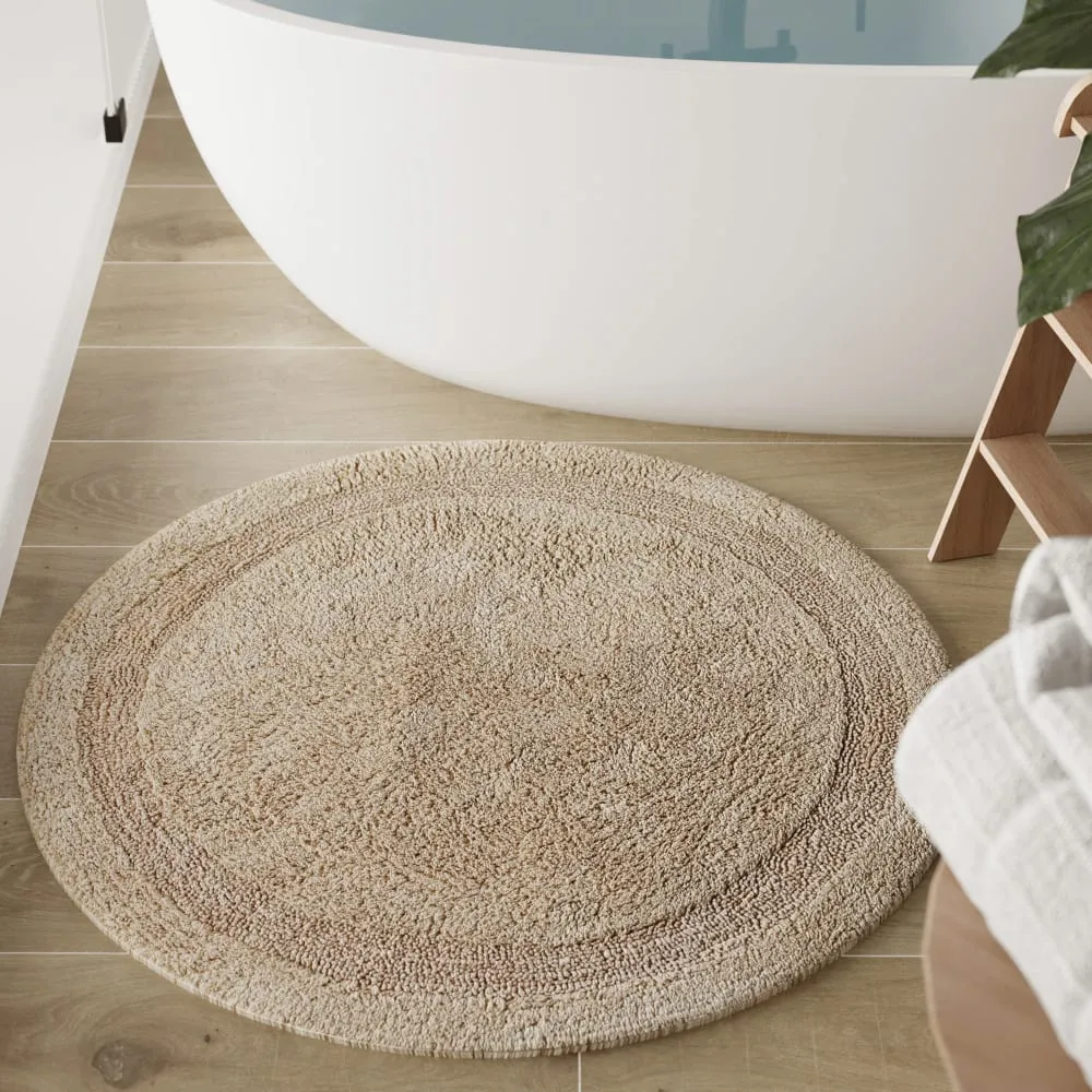 Illustration numéro 2 du produit Tapis de bain beige rond en coton 80 rd.