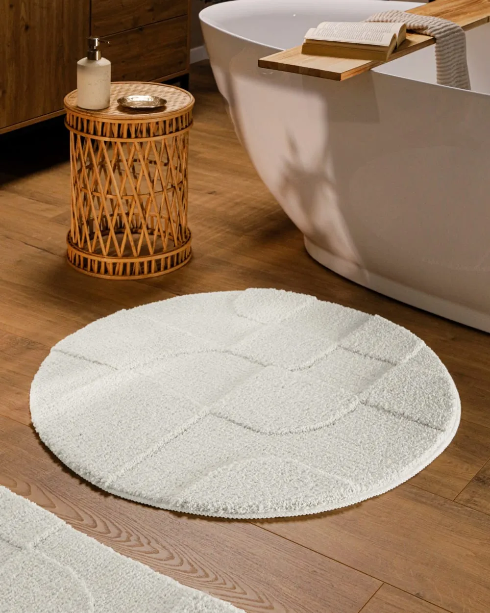 Illustration numéro 2 du produit Tapis de bain rond à relief blanc 80 rd.