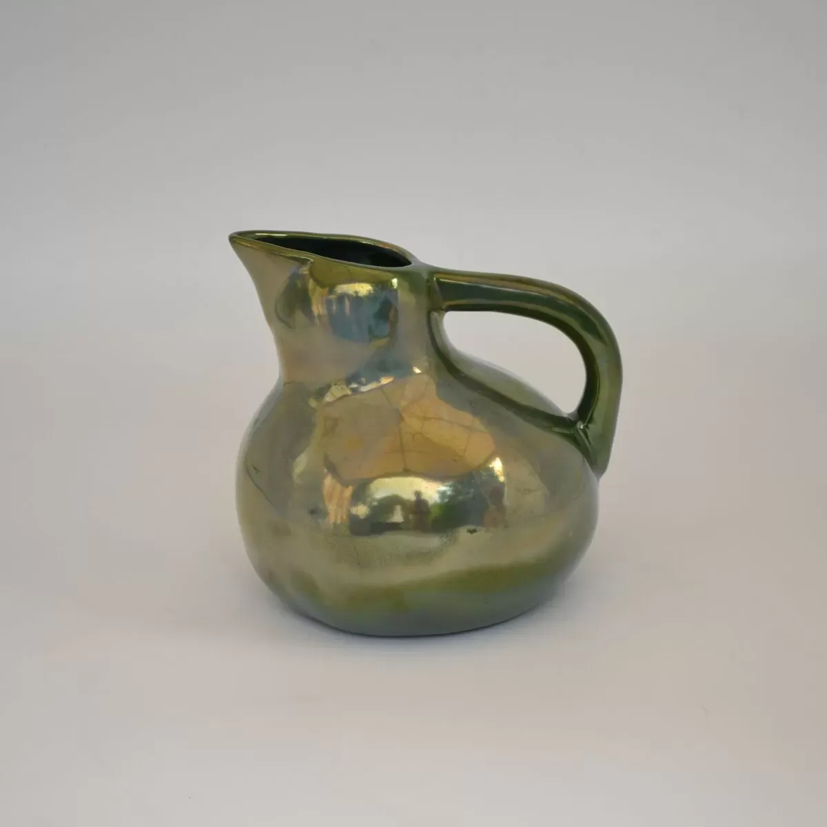 Illustration numéro 2 du produit Pichet en grès flammé à reflets métalliques de la S.A.P.C. de Rambervillers