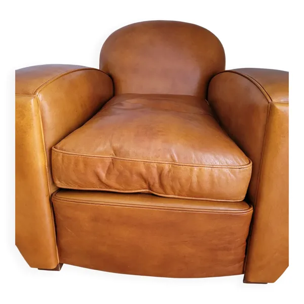 Illustration numéro 2 du produit Fauteuil club en cuir et son pouf