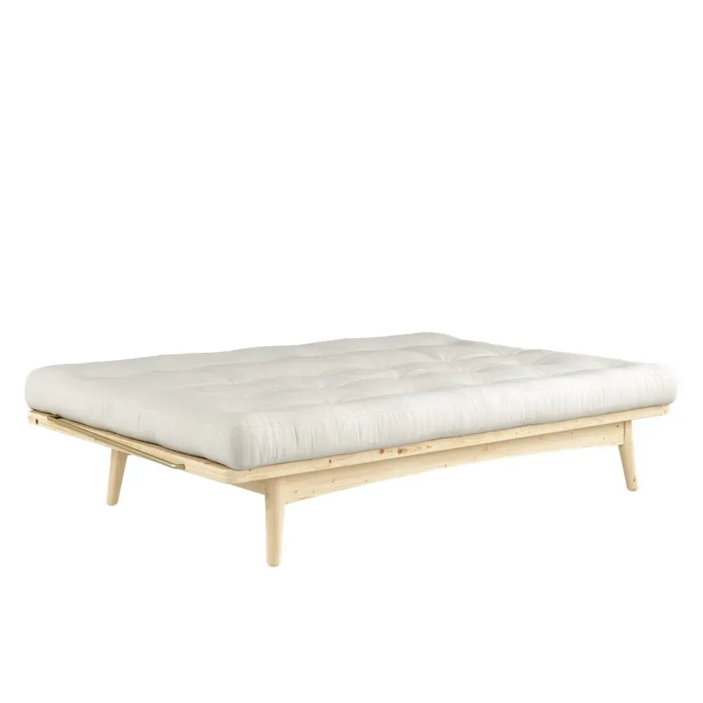 Illustration numéro 3 du produit Banquette futon FOLK en pin massif coloris naturel couchage 130 x 190 cm.