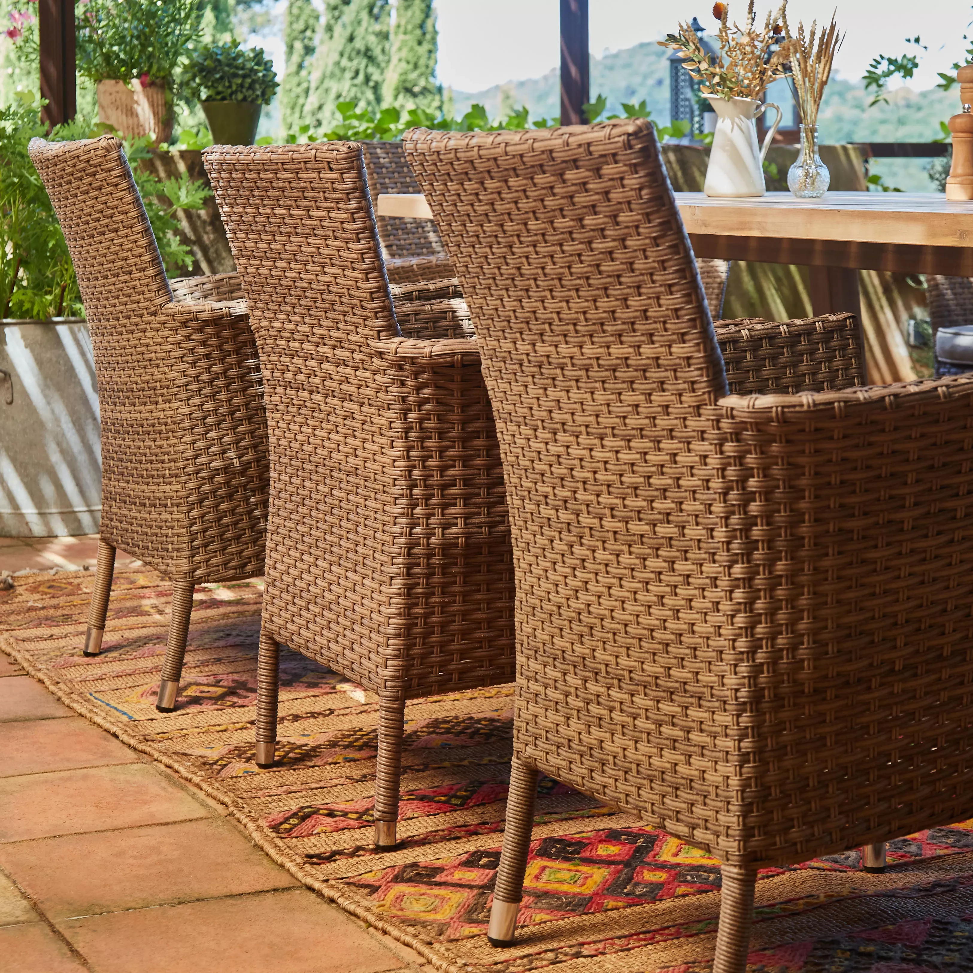 Illustration numéro 3 du produit Table en céramique terre cuite 205x105 et 8 chaises empilables rotin