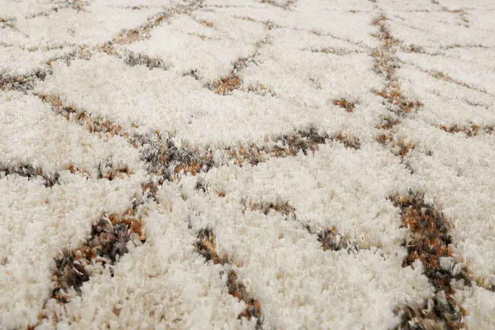 Illustration numéro 3 du produit Tapis à poils longs design géométrique beige chiné et brun 133x200