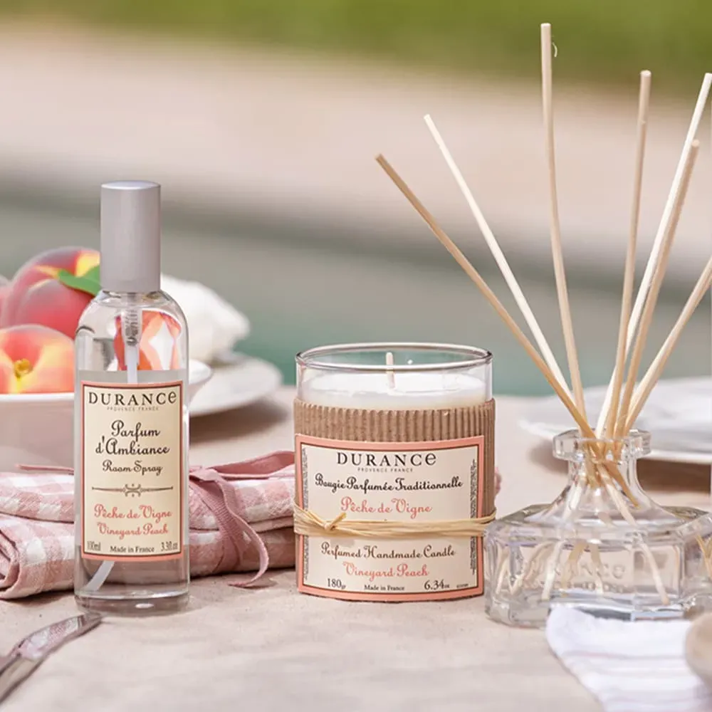 Illustration numéro 3 du produit Bougie parfumée pêche de vigne