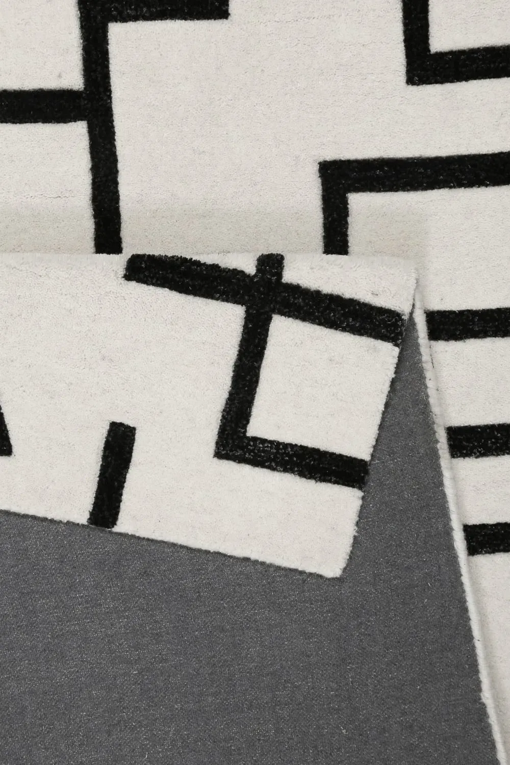 Illustration numéro 3 du produit Tapis design graphique tufté pure laine ivoire et noir 160x230