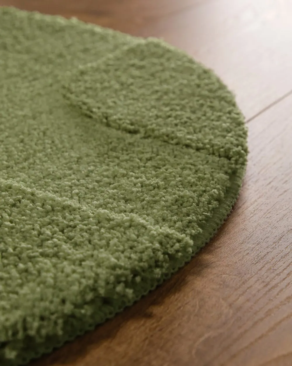 Illustration numéro 3 du produit Tapis de bain rond à relief vert olive 80 rd.