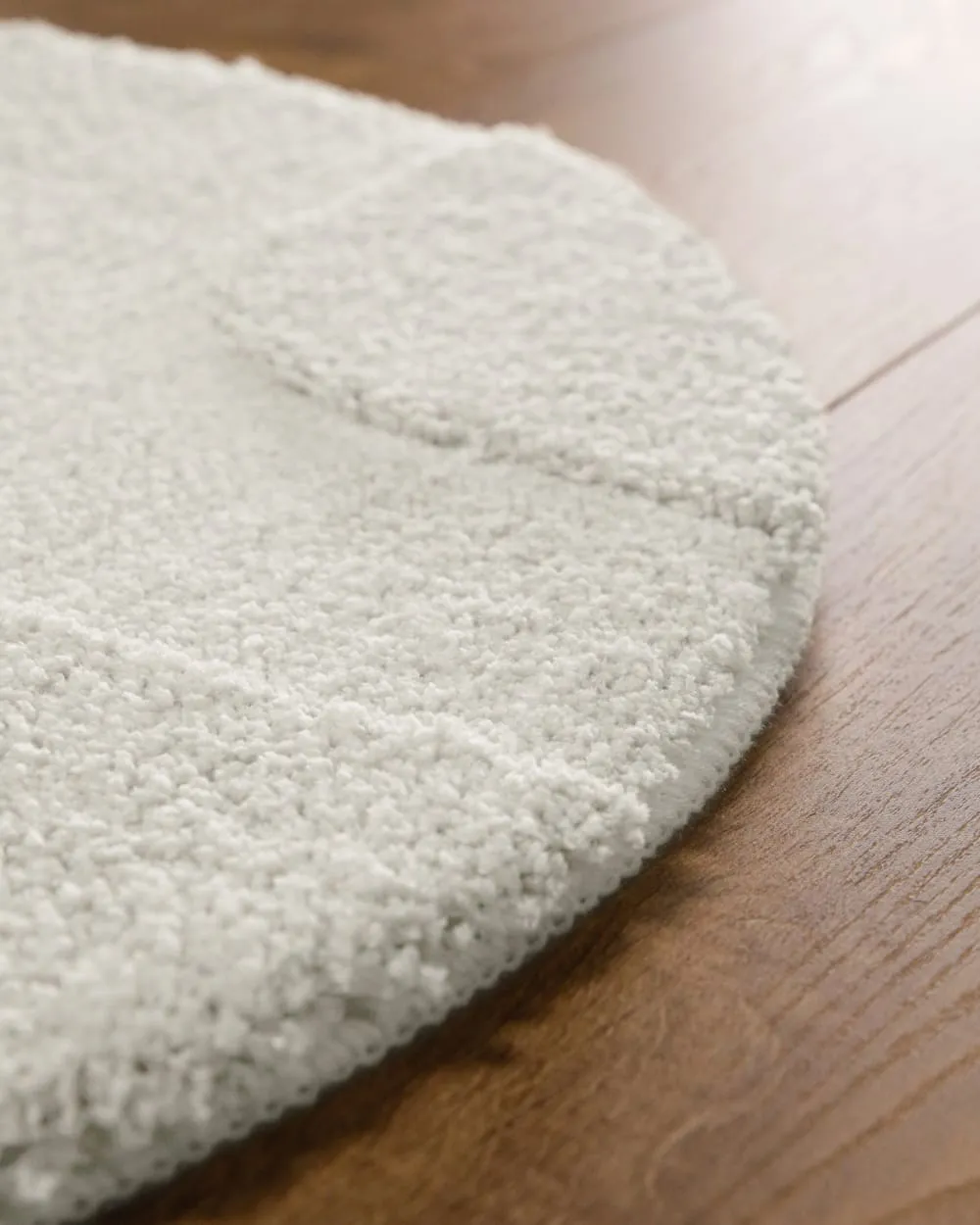 Illustration numéro 3 du produit Tapis de bain rond à relief blanc 80 rd.