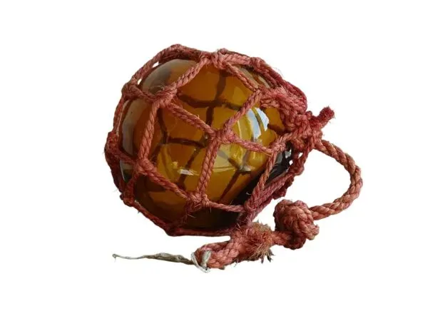 Illustration numéro 3 du produit Flotteur de pêche vintage français en verre ambré