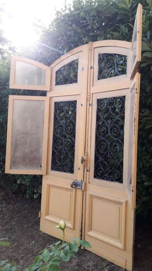 Illustration numéro 5 du produit Porte d'entrée cintrée double en chêne, grilles et verre, XIXème